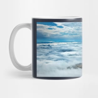 Little island in a sea of clouds Mug